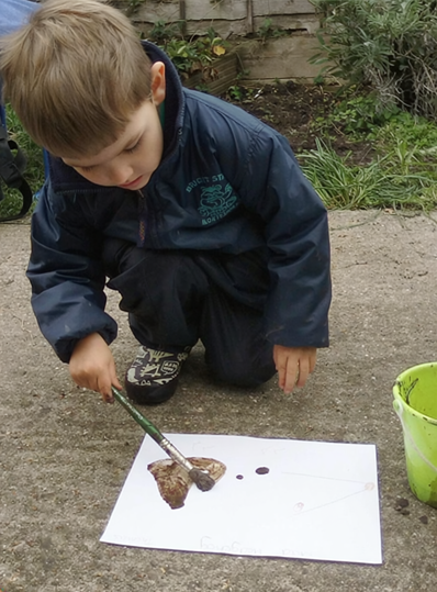 Children playing outdoors in the woodland garden